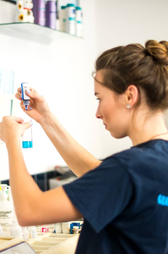 woman working in lab using a testing solution