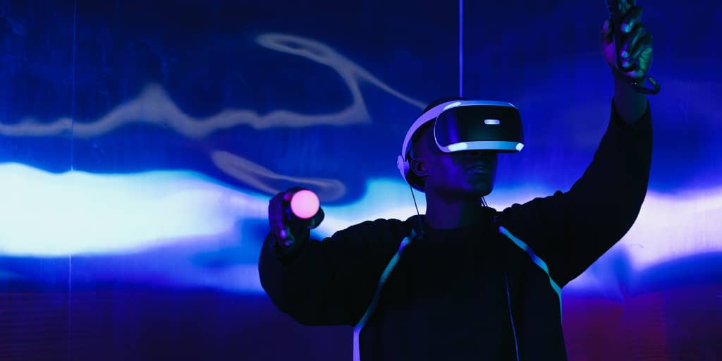 a man using a virtual reality game set