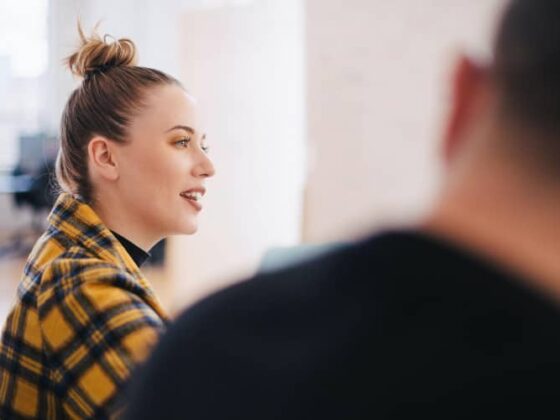 female discussing work with her employees