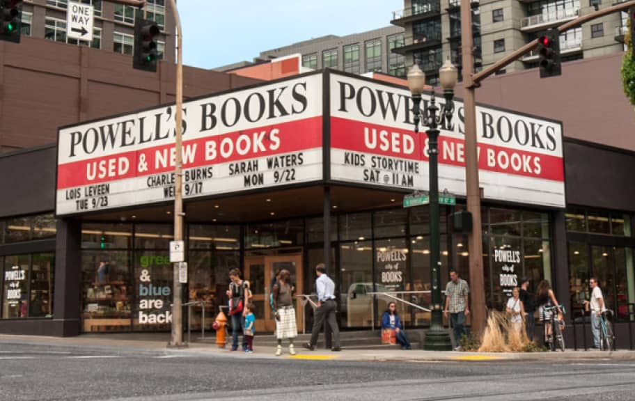 A photograph of Powell's Books, shot from across the straight and focused on the main entrance